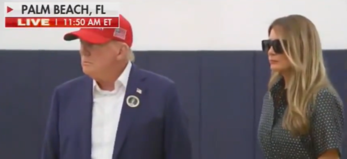 I wonder how much he had to pay her for this one.

It seems part of the deal was that she could show up in partial disguise and stand six feet away from him.