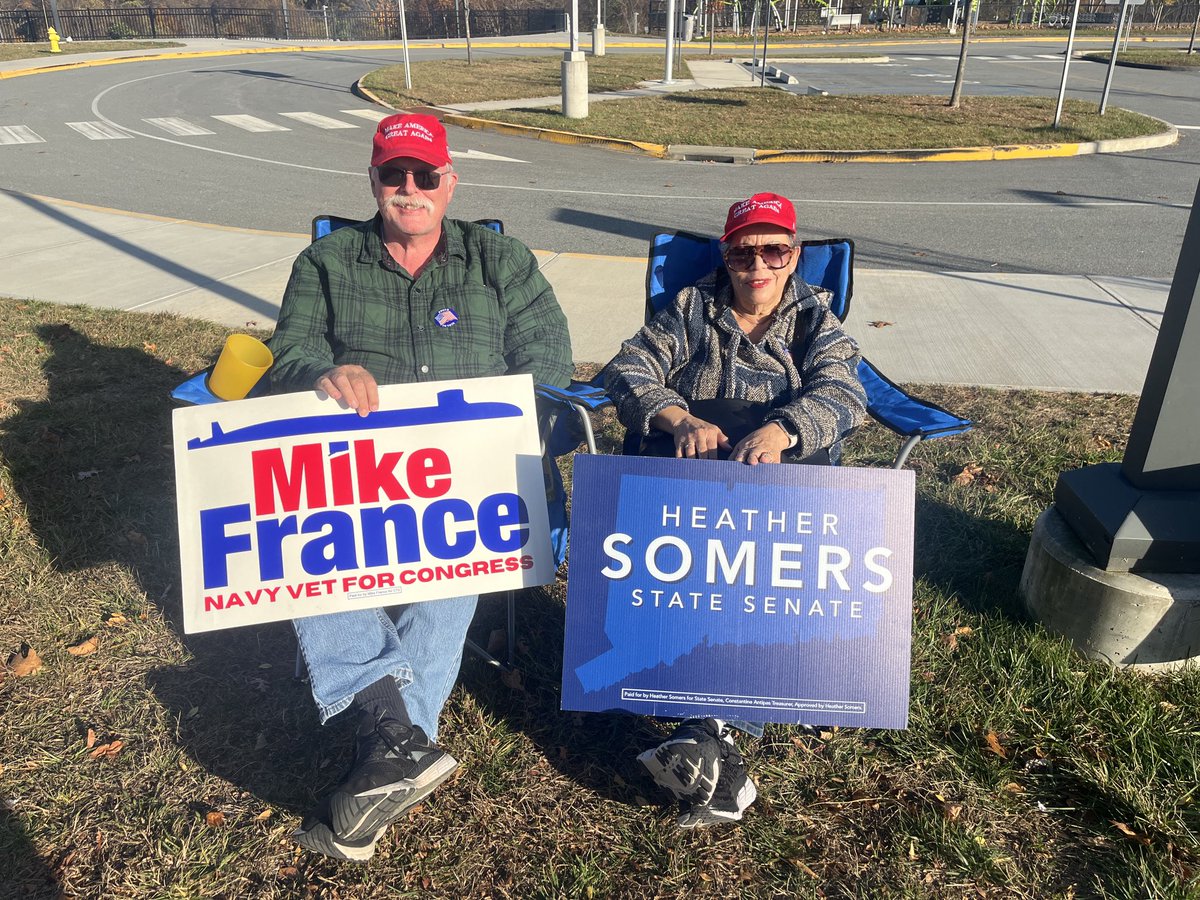 Groton residents Edmund and Nadine Conrad support congressional candidate Mike France, state Sen. Heather Somers, R-Groton, and Trump outside the Thames River Magnet School in Groton.
