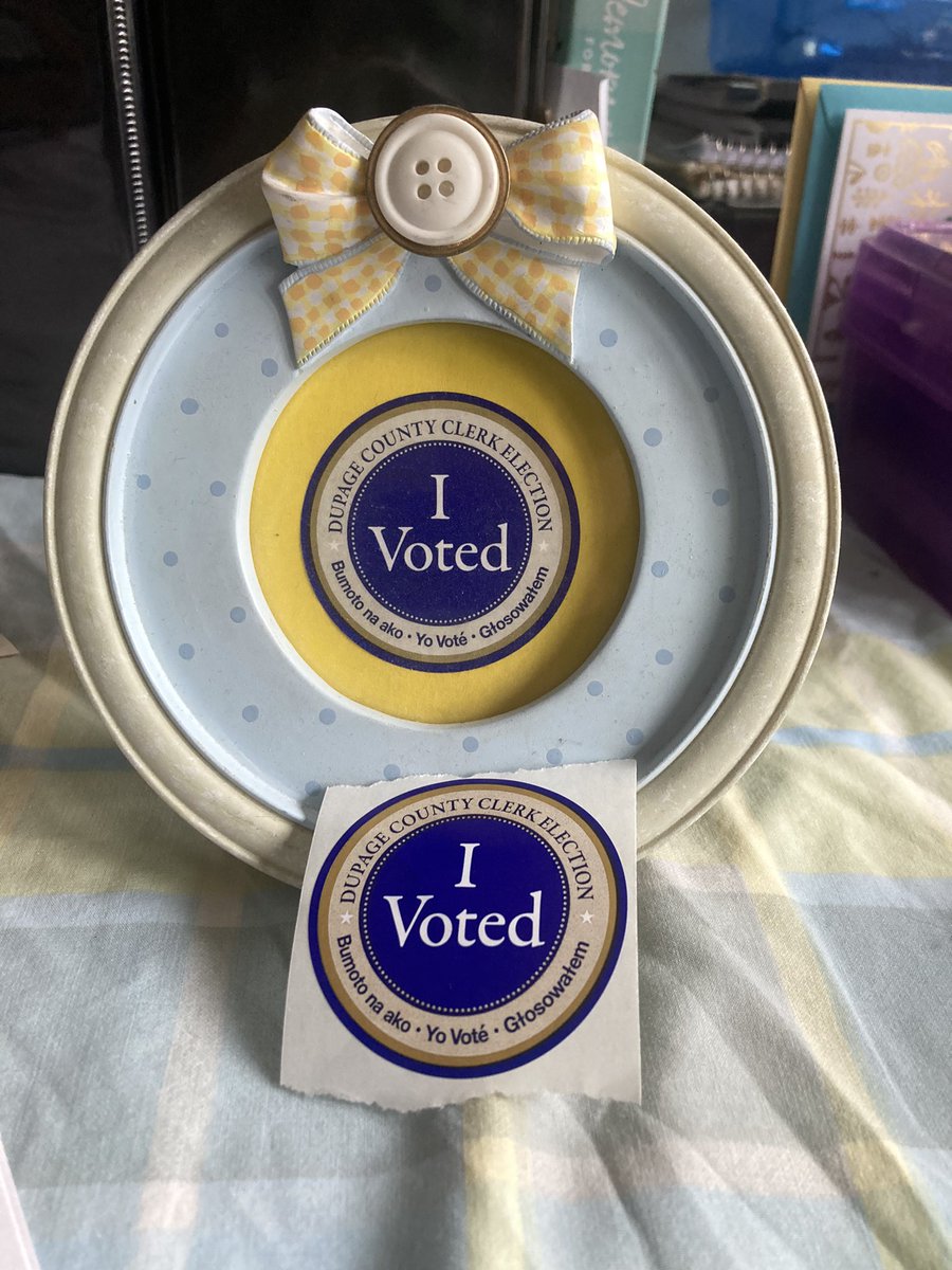 Treviriah's tweet photo. The framed sticker is from when I voted for Biden.  My sincere hope is that the sticker on the bottom helps end our national nightmare.  #HarrisWalz2024InALandslide https://t.co/Ae2694MxHU