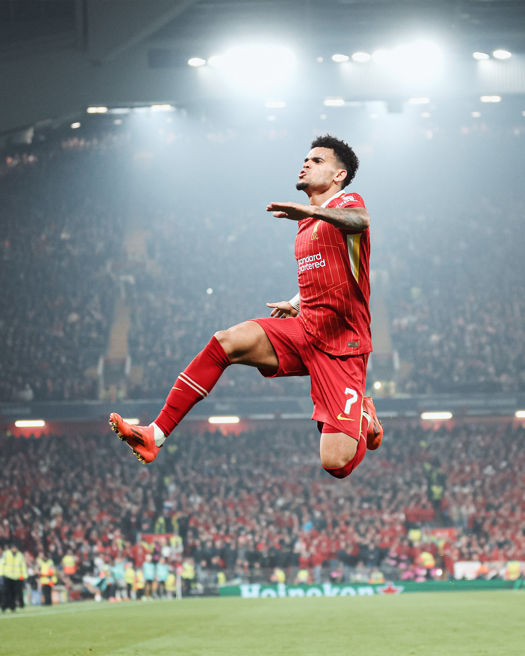 Photography of Luis Diaz celebrating his goal against Bayer Leverkusen.