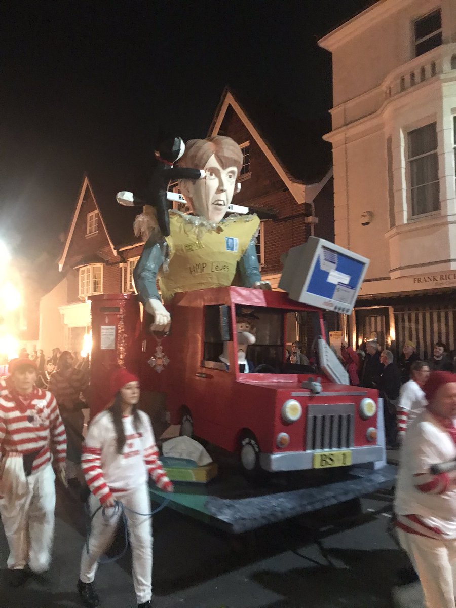 An effigy of Paula Vennells, wearing an envelope addressed to HMP Lewes, is pulled through the streets by people in Justice For Postmasters t-shirts. It will be blown up later tonight #LewesBonfire