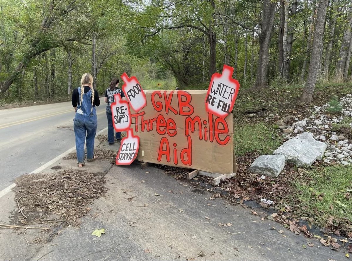 September 29th: Day Three pt.2 
Three Mile Aid Station

Thats me with the braids, walking alongside my sister after we’d set up our first signs for the station we’d run for a day now. With no service on the mountain, a working starlink was the most valuable thing we could offer.