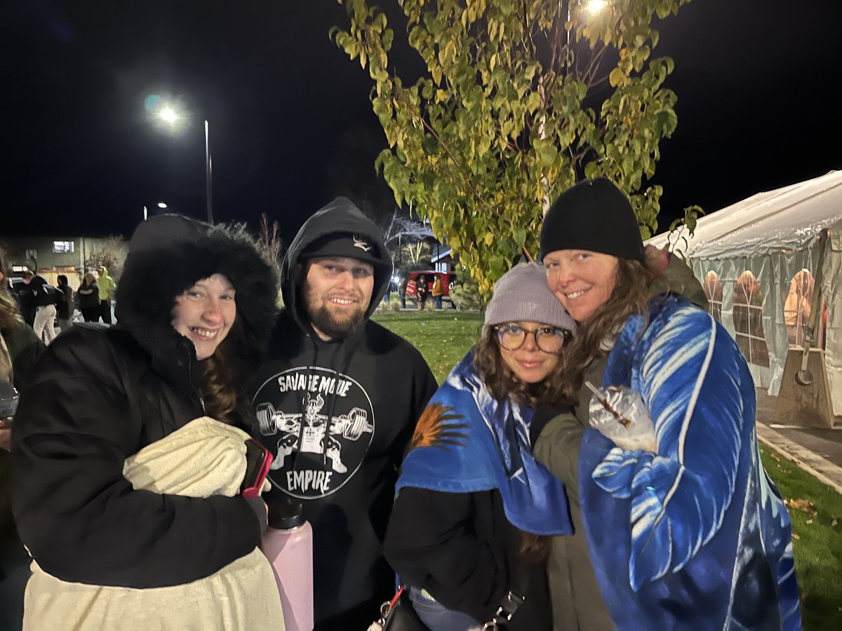 Travis Tovrea, second from left, is keeping a timer and has been in line an hour and 40 minutes. A fellow line-stander, right, estimates another hour before registering. Chilly but not snowing in Missoula. #mtpol