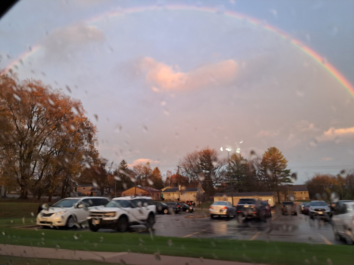 There was a perfect rainbow tonight when we went to ceramics.  I was trying to shoot from a moving vehicle.  I've never seen such a perfect arc on one before.