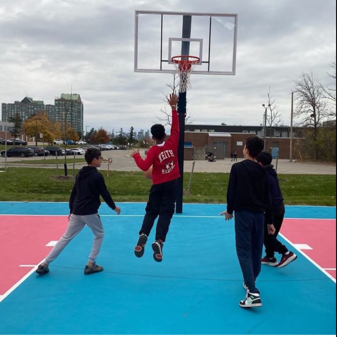 Students checking out the new basketball court at Erin Mills.