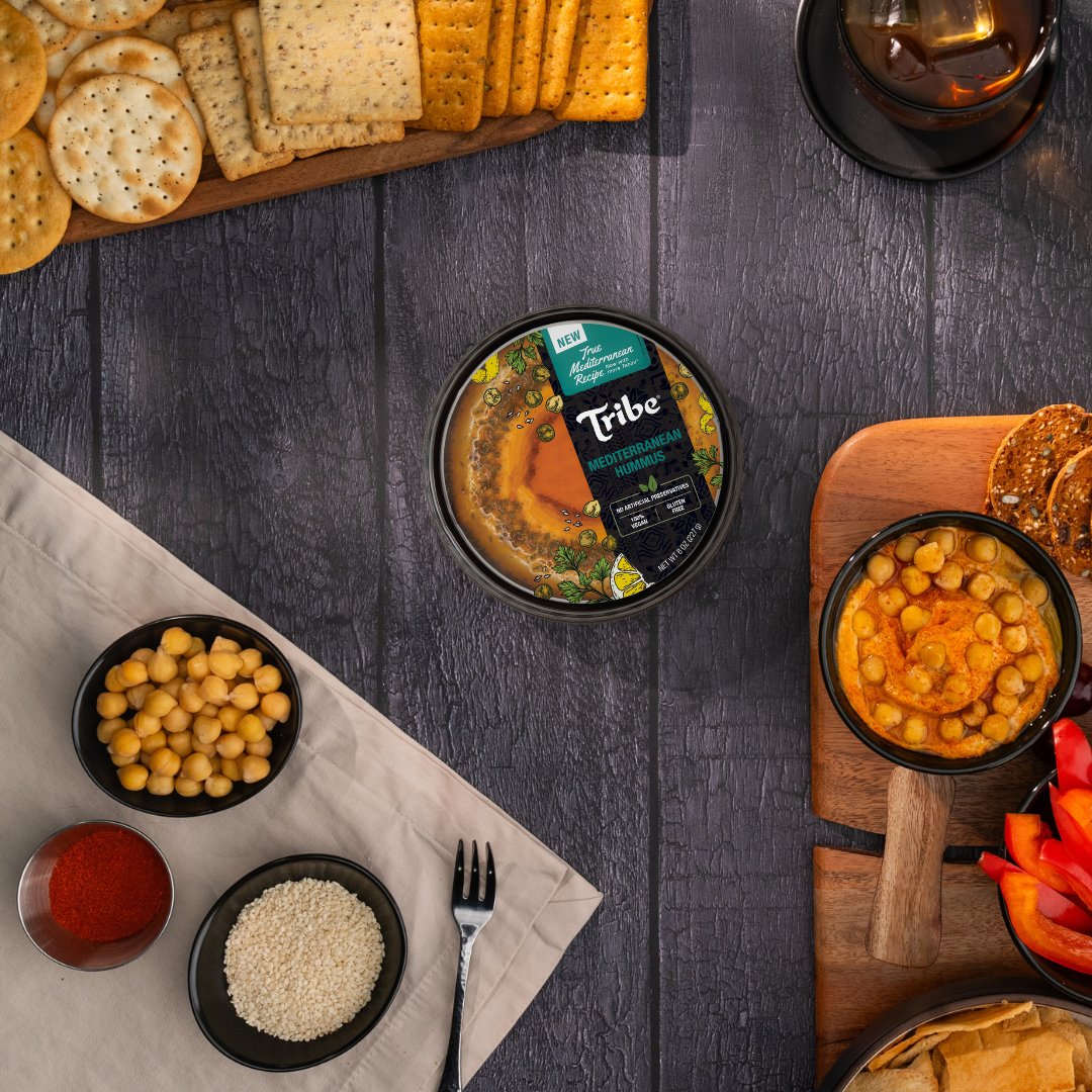Our Mediterranean Hummus is your quick ticket to the Greek isles:  Rich. Exotic. Vibrant. Every bite carries the signature taste of savory olive oil with the tang of paprika.

#Tribe #AuthenticHummus #AuthenticMediterranean #CharcuterieBoard