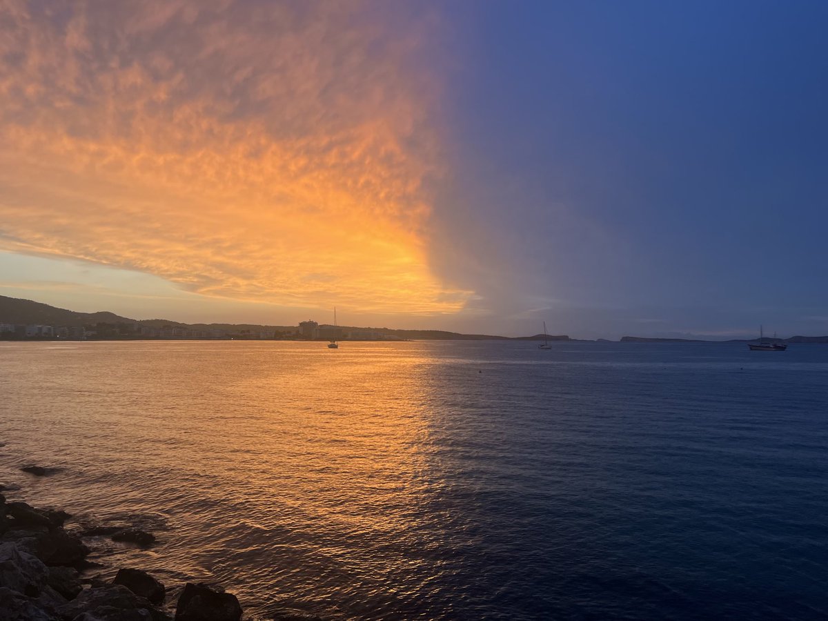 Sharing a photo of a remarkable sunset. Behind the thick cloud that obscures the light splitting the sky in two, there is still the sun.