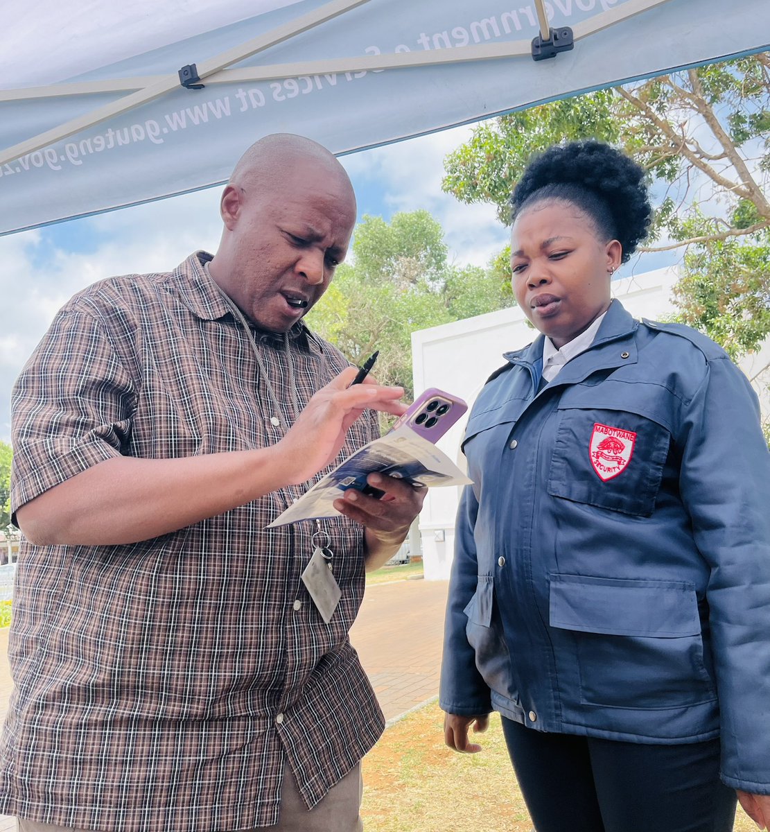 GautengeGov's tweet photo. Our officials were on the ground in Mogale City, helping residents download this essential safety app—available on both the App Store and Google Play. Your safety is now just a tap away! Download the app today and stay protected. #GautengEPanicButton #YourSafetyMatters https://t.co/4M4DCRlboI
