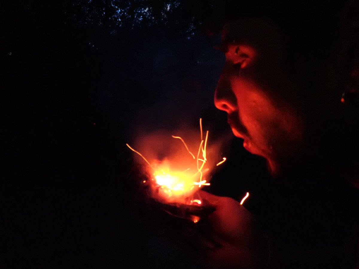 Learning fire by friction brings out determination in students, at times training at night. You can see the unsuccessful embers of this students prior attempts added to his tinder bundle in the foreground. But he did make fire that night!
Stay safe! Cody