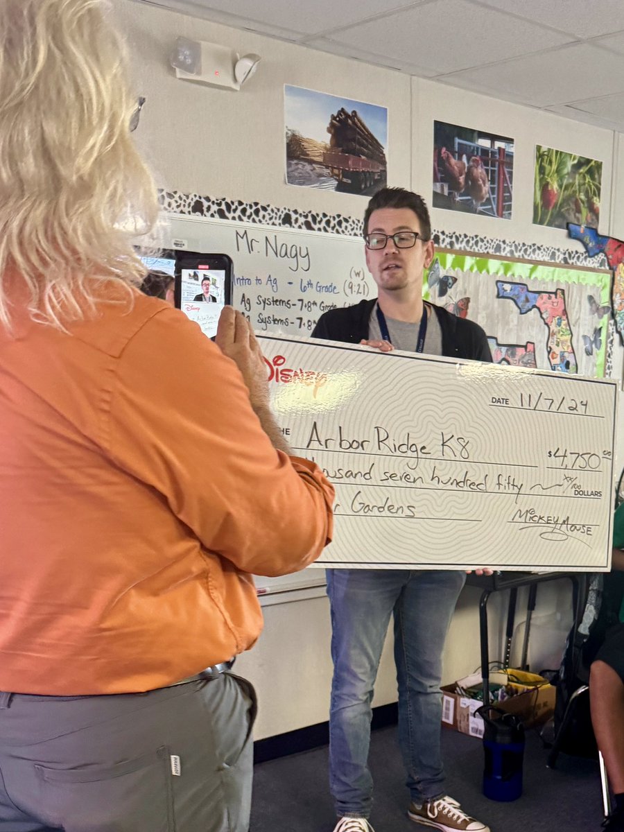 🌱✨Today, our Ag Teacher, Mr. Nagy, accepted an exciting surprise from <a href="/Fdn4OCPS/">Foundation for OCPS</a> — a Disney Impact Grant of $4,750! This generous grant will help our Arbor Ridge K8 students cultivate greener gardens and foster a love for agriculture. 🌿🌟 #TeacherImpactGrant #GRANTedbyDisney