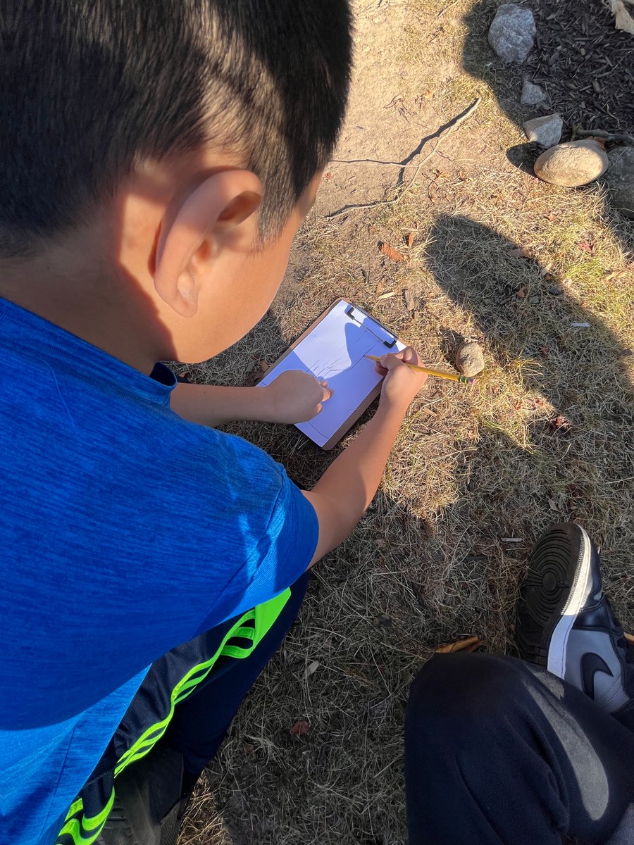 Art teacher Mrs. Hungaski sketches a beautiful tree on this gorgeous fall day with homeroom 14