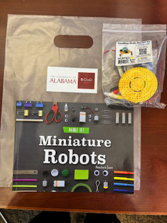 DCoaDLab's tweet photo. During a frightfully fun community outreach event the DCoaD Literacies Lab helped young explorers delve into the inner workings of a mesmerizing robotic candy dispenser, learn all about circuits and robotics, and receive materials to build their own bots at home! https://t.co/pXBBn54bgJ