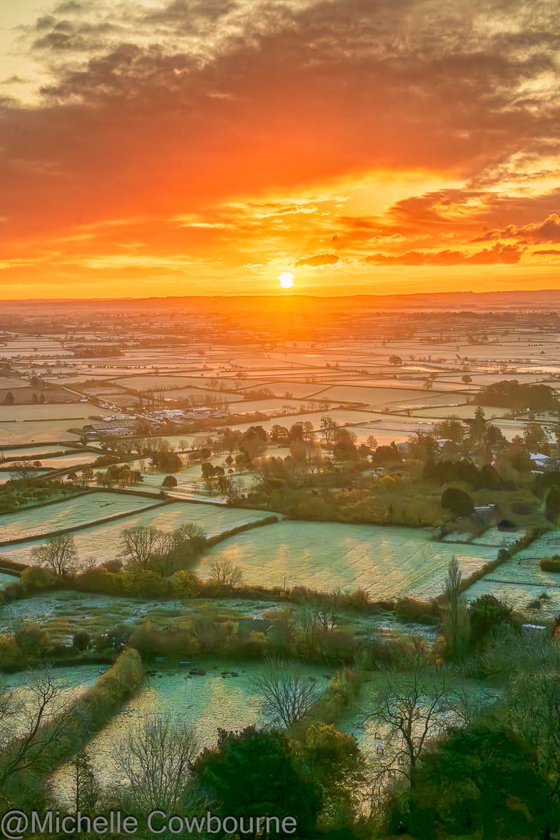Ice cold sunrise this morning. Taken on Glastonbury Tor looking out over the Somerset levels.