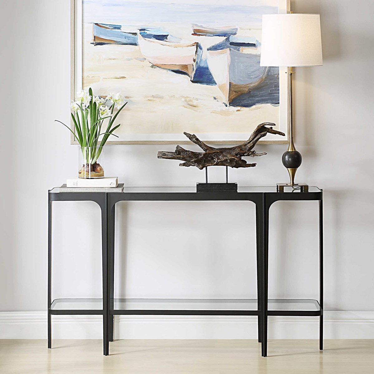Searching for sleek, clean, design? Look no further than our Atchison Console Table. Gently curved corners and a satin black iron frame, this uniquely designed console table brings a relaxed elegance to any room. Shop this look here l8r.it/4vd3.