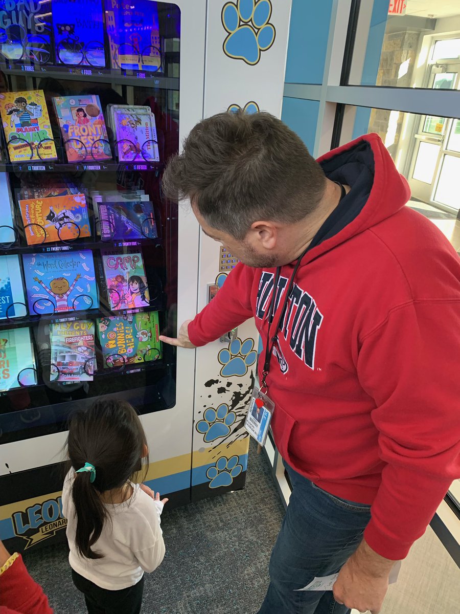 SURPRISE!  Today was a surprise Attendance Incentive Day at OLE. Principal Sowders drew a name of a student in attendance today from each grade level to get a book from our brand new book vending machine!