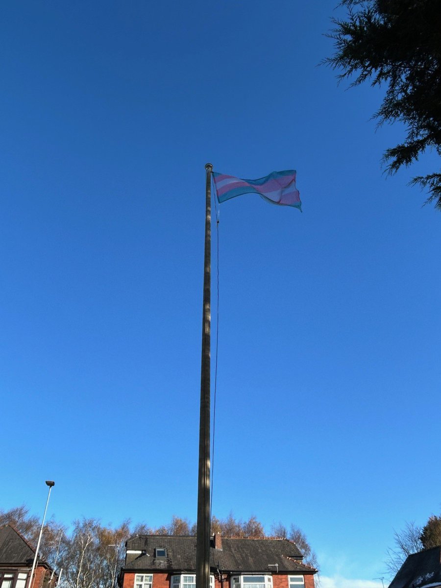 Today, allies and our amazing Rainbow Staff Network came together to raise the trans flag <a href="/manchesterfire/">Greater Manchester Fire and Rescue Service</a> HQ.

This mark of solidarity comes on Trans Day of Remembrance and commemorates those in the trans and non-binary community who lost their lives as a result of hate.