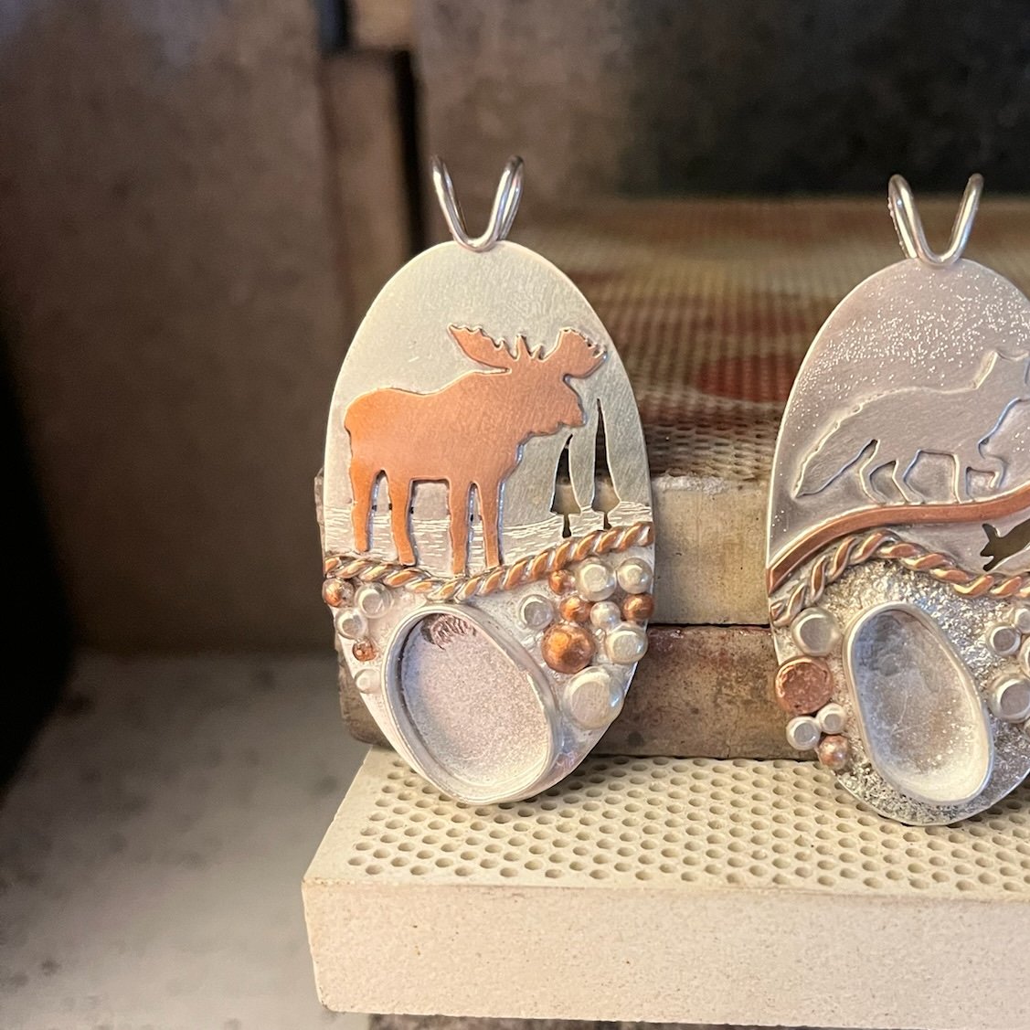BethMillner's tweet photo. A little behind the scenes of our Keweenaw Giant Copper Lake Superior Agate pendant! 🫎 
https://t.co/WZ8JSrhlmI
#moose #copperagate #sterlingsilver #diamond #copper #pendant #bethmillnerjewelry https://t.co/zz7IkD5OlZ
