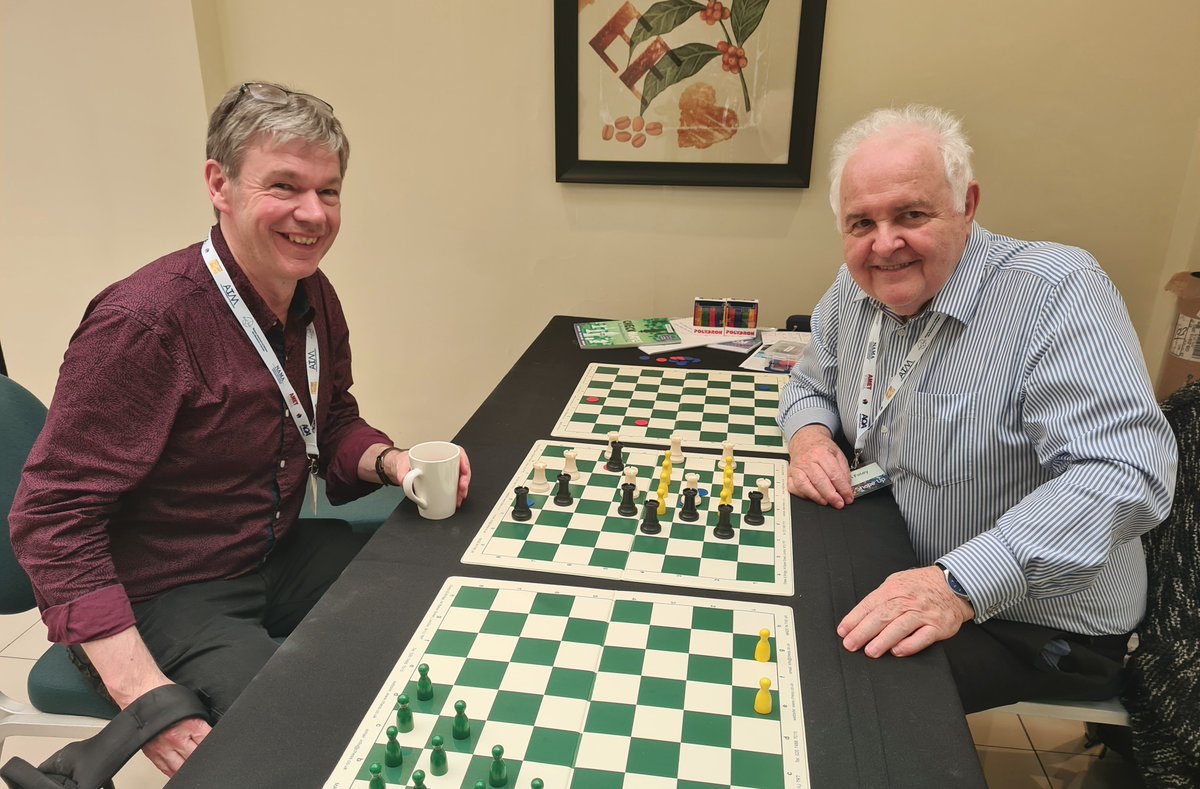 logiqBoard's tweet image. Sharing this fab photo on @ChessScholar &apos;s birthday  🎉 John designed the Sliding Rooks game. Here he is playing with @robeastaway ! What a moment with these two legends talking chess, maths &amp;amp; Shakespeare @Mathematical_A #mathsconference 2024