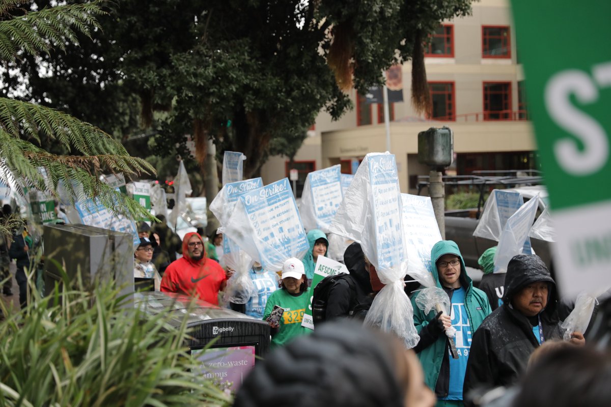 UPTECWA's tweet photo. The rain didn’t stop UPTE researchers, healthcare professionals, and technical workers from showing up and out! We’re making it clear to UC: Stop bargaining in bad faith and using illegal, unfair labor practices. #UPTE #UnionStrong #UC #UofCalifornia #ResetUCPriorities https://t.co/Cn5JjX9Zhp