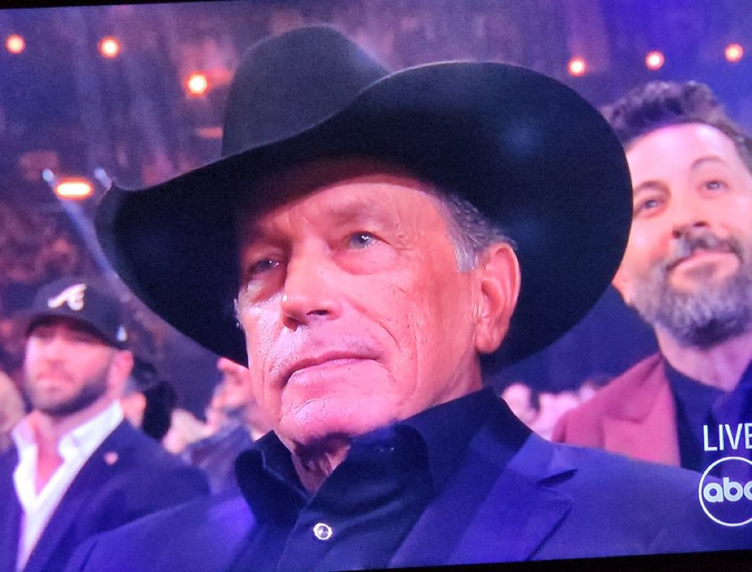 JaredLChris's tweet photo. George Strait trying to figure out what the hell he’s watching as Bailey Zimmerman does cartwheels on the stage at the #CMAawards 😂 https://t.co/wFOBWmytIu