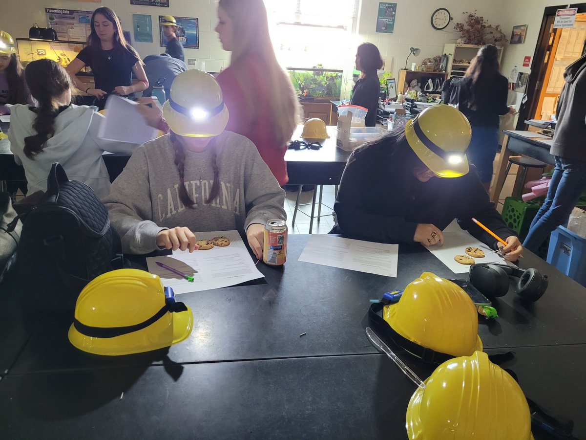 Students are hard at work mining cookies to extract the "coal" and attempt to reclaim the land in Ms. Sheldon's class. Some students chose other treats representing additional mining techniques, leading to an overall discussion on cost-benefit analysis to close out the lesson.