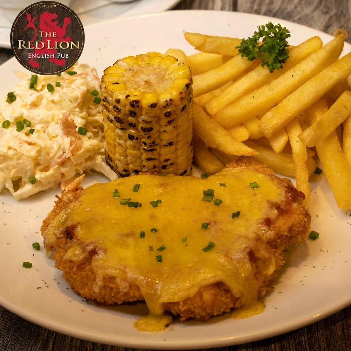🍗✨ Craving comfort food with a crispy twist? Try our Chicken Parmigiana—golden-fried perfection topped with rich tomato sauce and melty cheese. 😍🍴 #ChickenParmigiana #ComfortFood #FoodieGoals