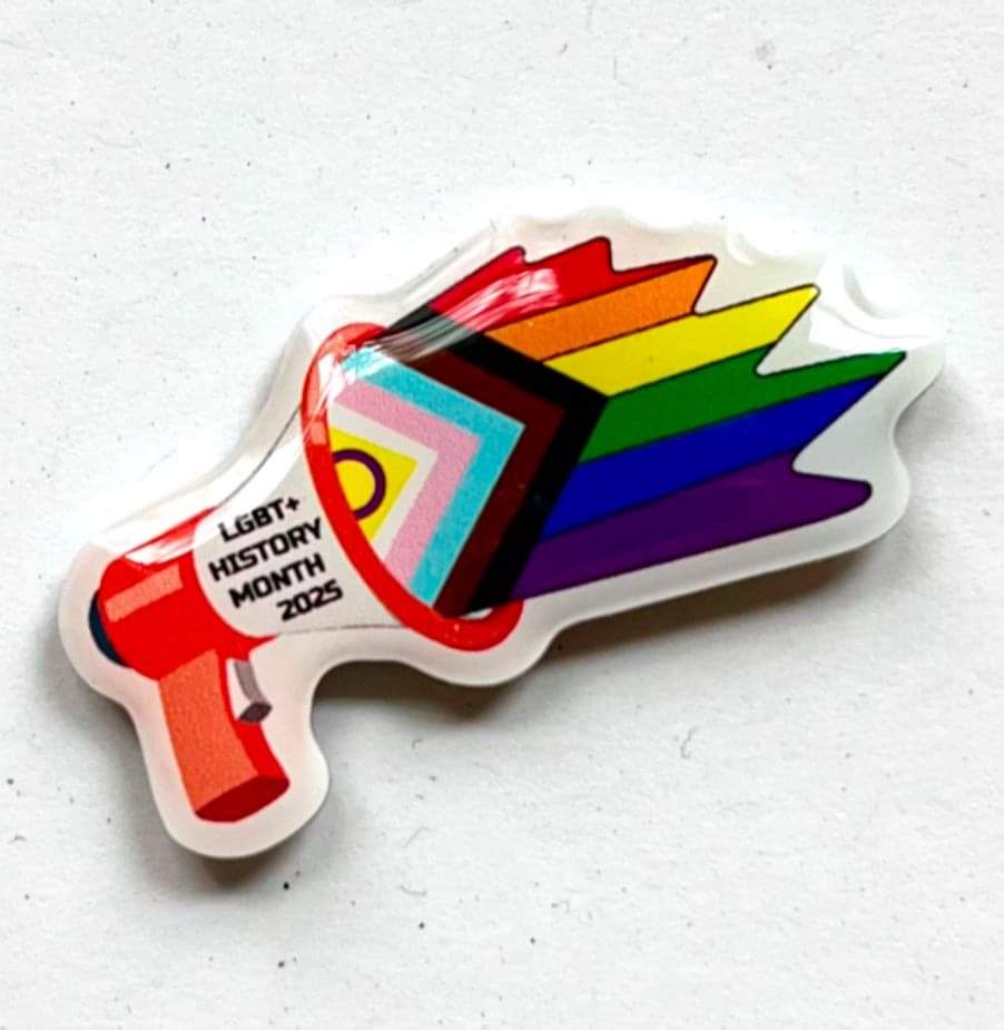In June we run a badge competition for Schools and youth groups to design the LGBT+ History Month Badge, the winning design is then turned into the official LGBT+ History Month badge.

The 2025 badge was designed by a pupil from a school in Sunderland:
lgbtplushistorymonth.co.uk/shop/