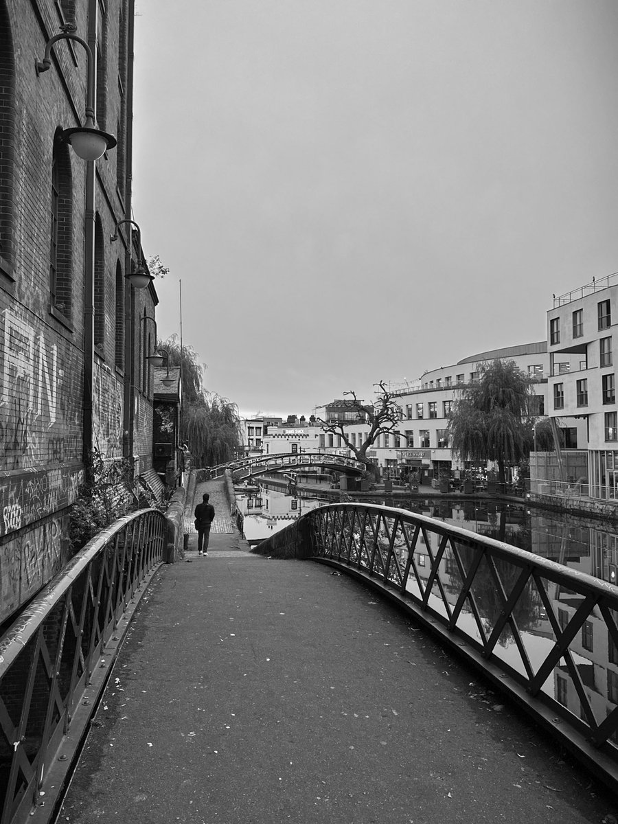 Man walking over bridge. On my way for a coffee this fine, Thursday morning.