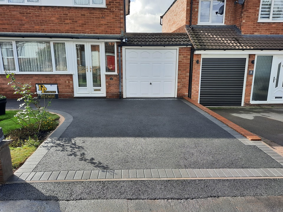 Take a look at this beautiful driveway, crafted by <a href="/DP/">David</a> Plant Driveways &amp; Landscapes with Castacrete block paving in Charcoal. 

Our bold, durable blocks provide a clean and timeless look that’s built to last, adding both style and function to any home exterior.