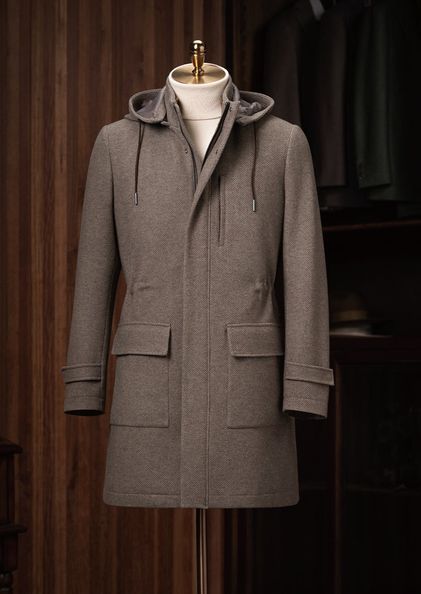 POLLHEIM_au's tweet photo. This taupe coat strikes the perfect balance between functionality and finesse. Designed to keep you cozy without compromising on style, it features a soft hood with adjustable cords and a sleek concealed button placket. Whether layered over casual or formal attire, its subtle detailing and spacious front pockets bring a modern edge to a timeless silhouette. Elevate your wardrobe with this sophisticated piece, ideal for navigating the colder months with effortless elegance.
#Pollheim #fashion #style #handmade #tailoring