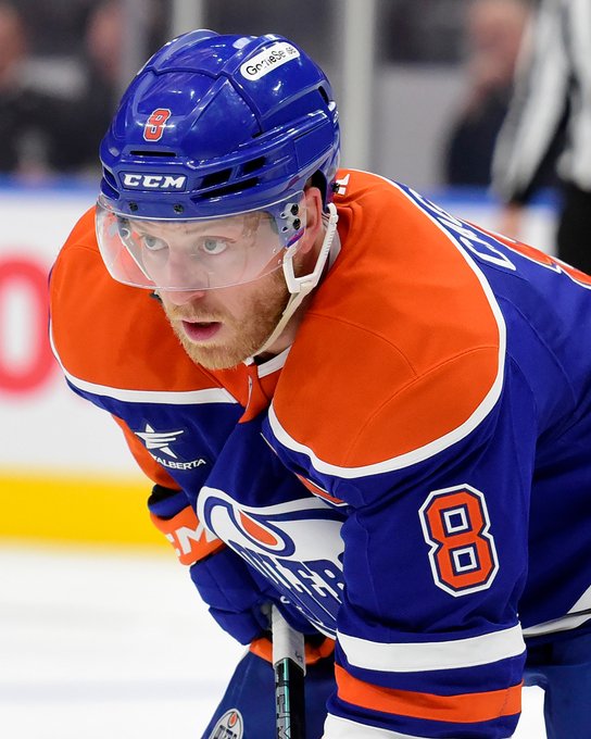 An action shot of Drake Caggiula awaiting a face-off during an Oilers game