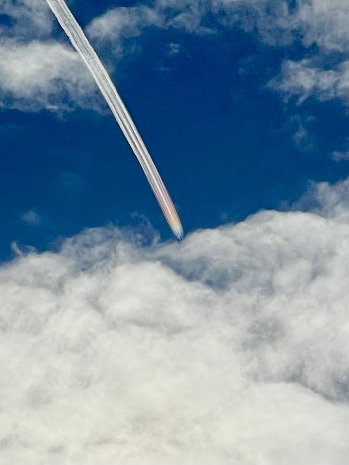 Iridescence in a contrail overhead in #Monterey just before the plane disappeared behind the clouds. #CAwx