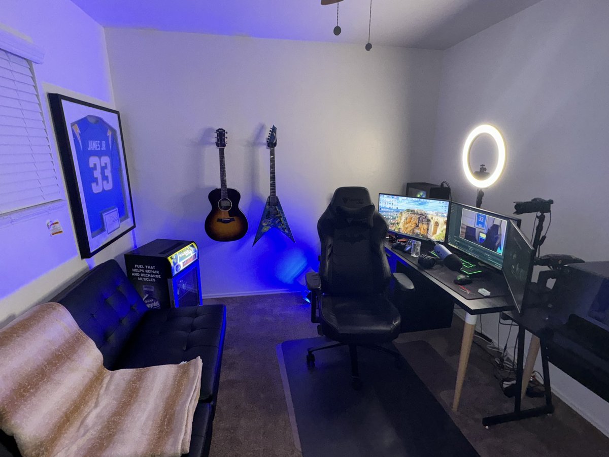 Room semi done just missing the tv I gotta mount above the setup. How we lookin? Wall looks a bit empty but all I can picture there is 5 more guitars that I want but done have 🥲