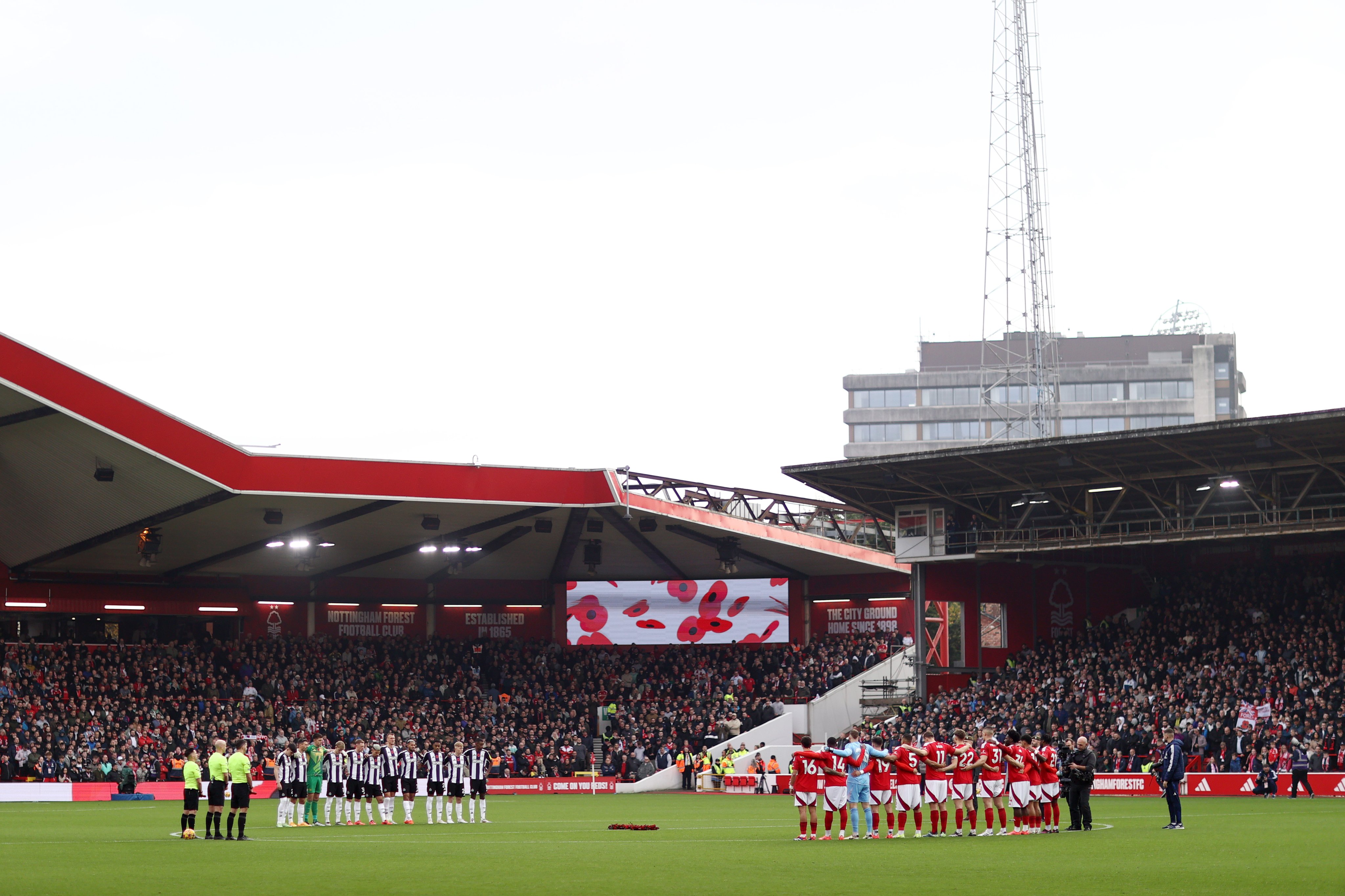 Both sets of players observe a minute's silence at the City Ground before kick-off