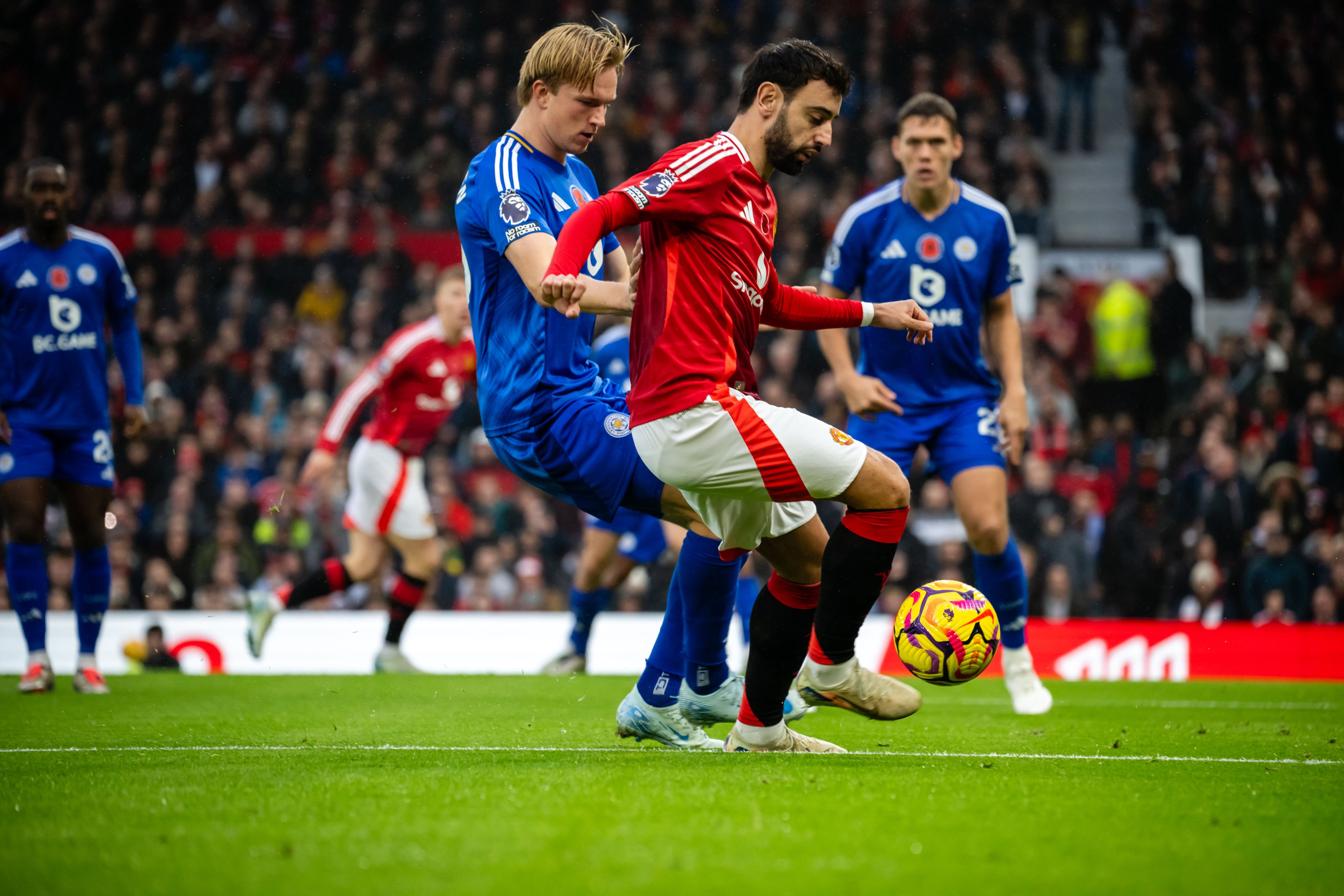 Bruno Fernandes attempts to dribble away from Victor Kristiansen.