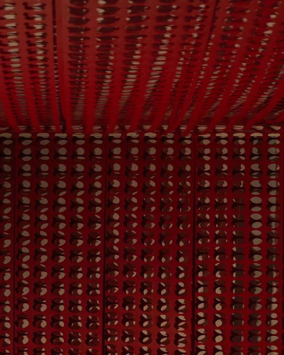 ‘I was invited to make a piece of work about the First World War. I had always wanted to go to the poppy factory in Richmond, London. Artificial poppies have been made there since 1922. When I visited the factory, I saw this machine that had rolls of red paper with perforations
