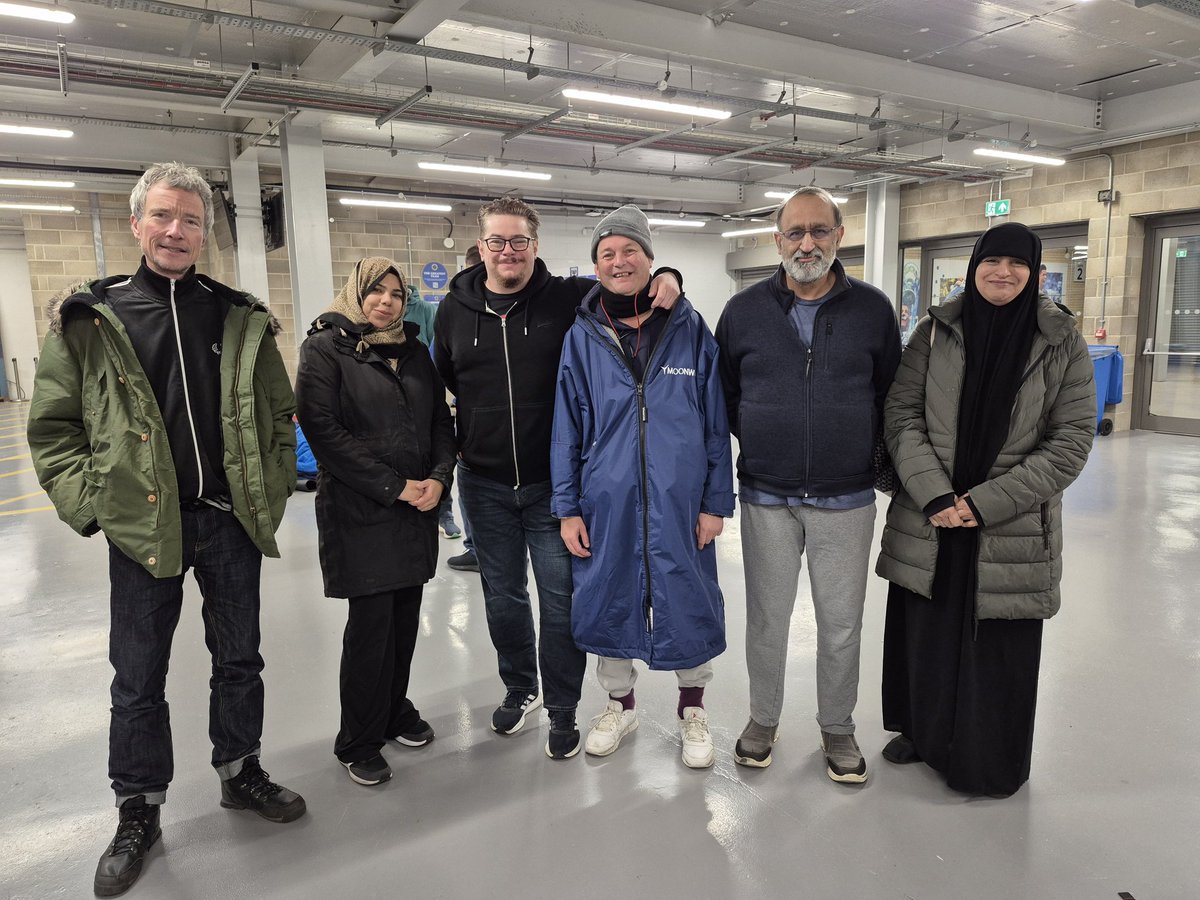TootingCKitchen's tweet photo. We did it!  Here's the TCK team at 6.30 this morning, tired and aching, after spending the night sleeping on concrete at @AFCWimbledon stadium for @DonsLocalAction fundraising.

There's still time to donate!
https://t.co/YLH4e2hnJB https://t.co/NngJXfszAJ