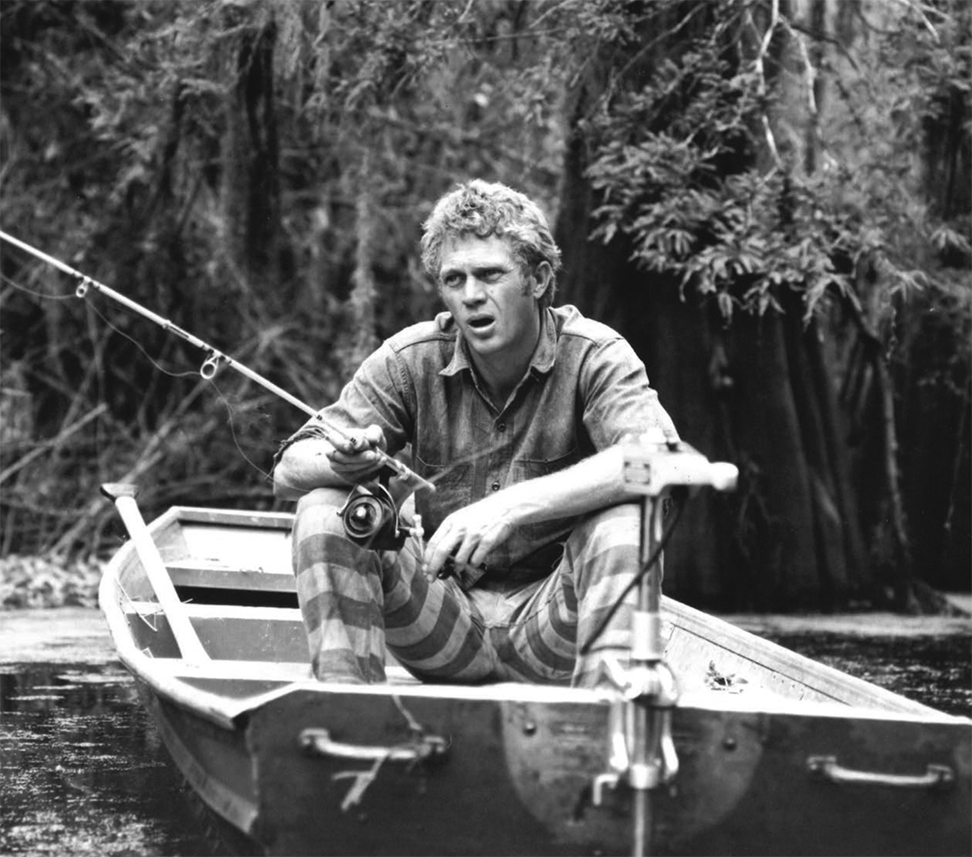 Steve McQueen fishing during a break from filming 1966's NEVADA SMITH. Known for his restless energy, McQueen was such a handful on set that the studio had to supply him with various distractions, this boat being one of them, to keep him entertained #SteveMcQueen #Hollywood