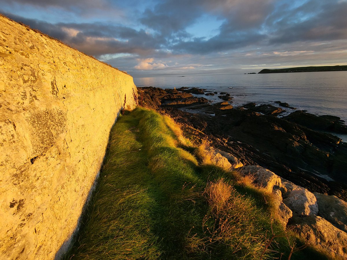 Beautiful light around Ballinacourty lighthouse and Ballinard this evening