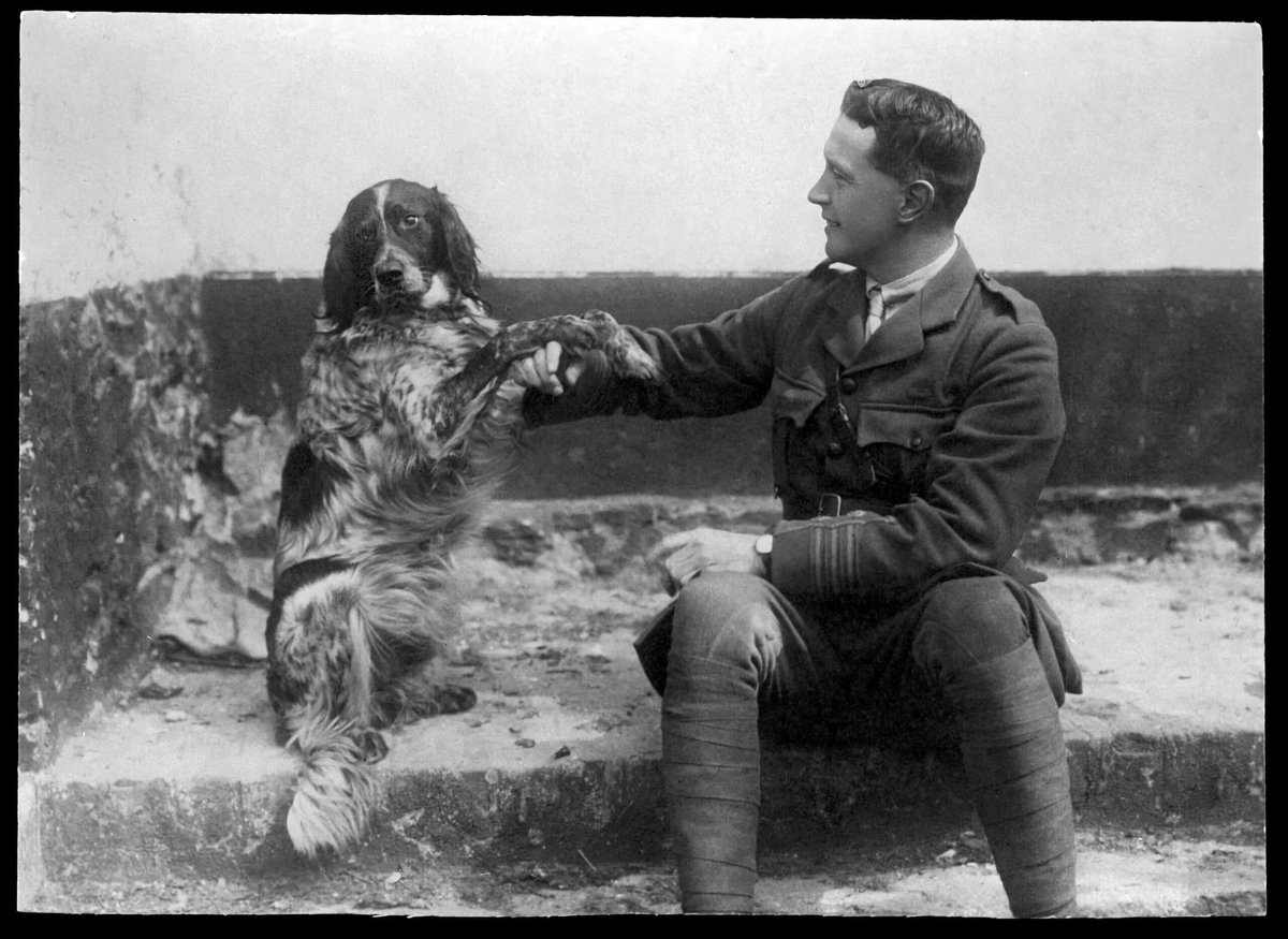 Lieutenant-Colonel John McCrae and his dog, Bonneau, in 1914 in Europe during WWI. McCrae would write "In Flanders Fields" the following year.