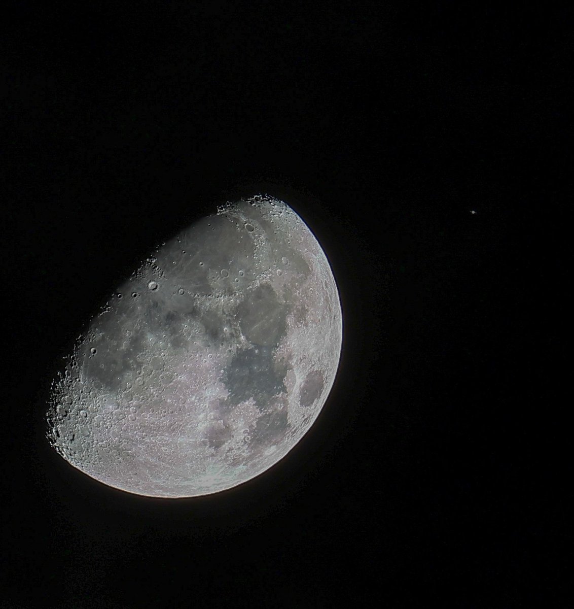 The mostly cloudy skies with few breaks made this photo a challenge, but really happy with it. The Moon with Saturn (to the right and much, much smaller).