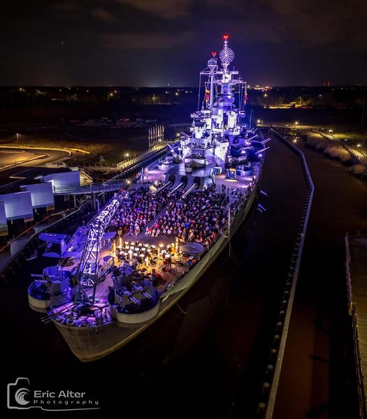 HOW COOL?! Battleship North Carolina was lit up for “Light the Legacy” during Veteran’s Day weekend. Awesome photo, Eric Alter Photography.