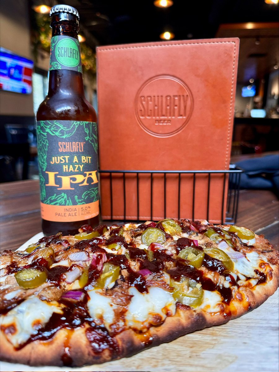 Schlafly's tweet photo. St. Louis Pizza Week began today! This is a 10" #BBQPulledPorkPizza at #SchlaflyBottleworks.
👇🍕
Made with pulled pork, red onion, jalapeños, our special cheese blend, and tangy BBQ sauce base. ONLY $10!
🍻🍺
#StlPizzaWeek #StLouisPizzaWeek #StlPizza #stlfoodie #stlfood #stleats https://t.co/kkz7k3DHaI