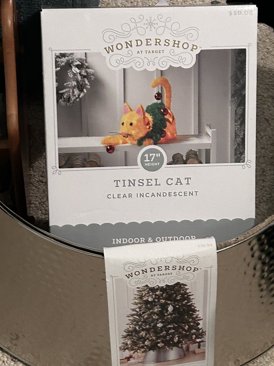 Krzykat's tweet photo. My impulse buys at Target today.  Both were 50% off.  I’ve wanted a metal tree collars, the tinsel cat was just cute. https://t.co/RfrgGftTFd