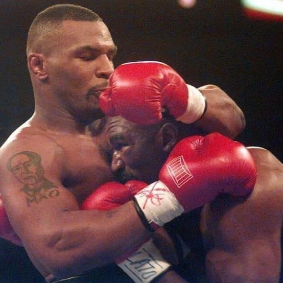 historyinmemes's tweet photo. On June 28, 1997, Mike Tyson bit Evander Holyfield's ear during their heavyweight rematch in the third round. This incident led to Tyson's disqualification and suspension from boxing, marking a bizarre chapter in his career.

Holyfield entered the rematch stronger than before. In the first round, he landed significant body shots while Tyson fought wildly, ignoring his trainer's advice. The crowd favored Holyfield by the end of the round. In the second, Holyfield accidentally head-butted Tyson, causing a cut above Tyson's eye.

Tyson's frustration peaked in the third round; he spit out his mouthpiece and bit off part of Holyfield's right ear, spitting it out onto the canvas. Despite the pain, the fight continued after a brief pause, but Tyson then bit Holyfield's other ear. With only 10 seconds left in the round, Tyson was disqualified. His $30 million purse was withheld pending review by Nevada boxing officials.