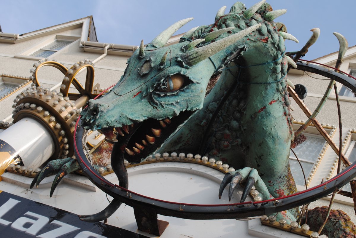 Charllayc's tweet photo. Digging through photos from 2014 and shout-out to the Rhyl dragon, highlight of every trip to Rhyl for me, I need to know who made you ❤️🐉 Will I ever make a dragon as cool and imposing as this? https://t.co/EVcdm7wQqb