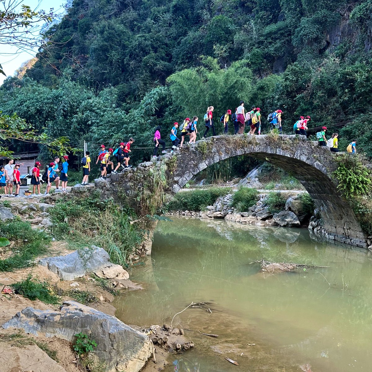 ESFGlenealy's tweet photo. What an exhilarating first day at Year 6 camp in Yingde, China! Children made traditional tofu sheets, built their tents, hiked to a 100-year-old bridge, and tackled team-building exercises. We ended the day with a delicious dinner at a local restaurant! https://t.co/8SSu7CCU72