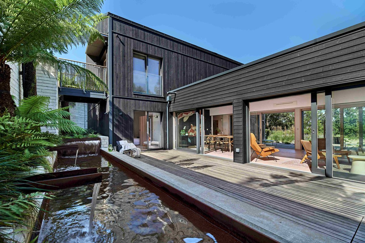 Contemporary Surrey home inspired by Japanese architecture with clean aesthetics and first floor open-plan kitchen, living space.