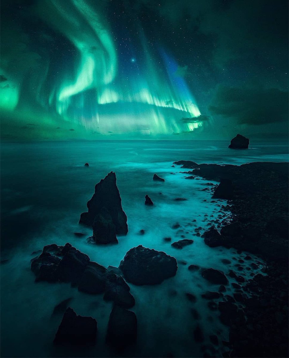 earthcurated's tweet photo. Aurora lights up the coastal sky in Iceland 💫 https://t.co/ofG34J17gA