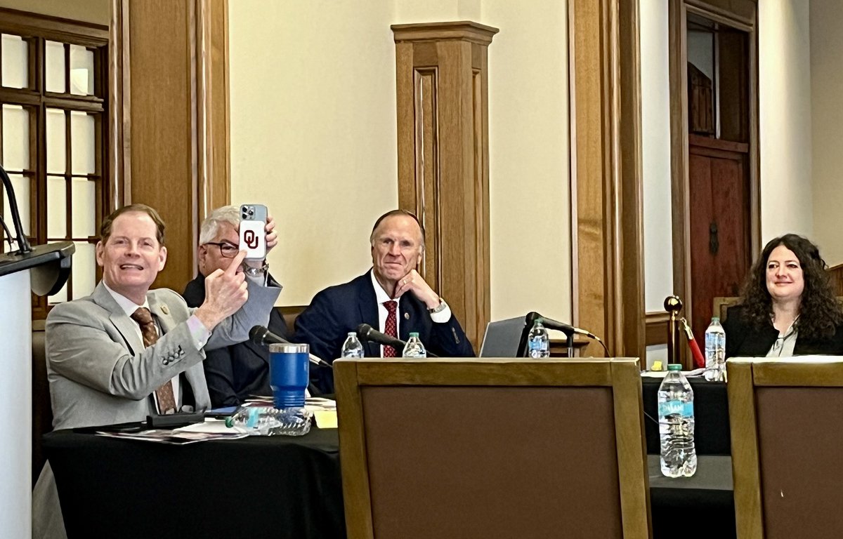 ThriceSavage's tweet photo. Regent Bob Ross gives his committee update, opening by showing off student-designed products (like this #OU-branded magnetic phone charger) through the Michael F. Price Business College's IBC program: https://t.co/4OVuJ5a1i4 https://t.co/Veuh803CBy